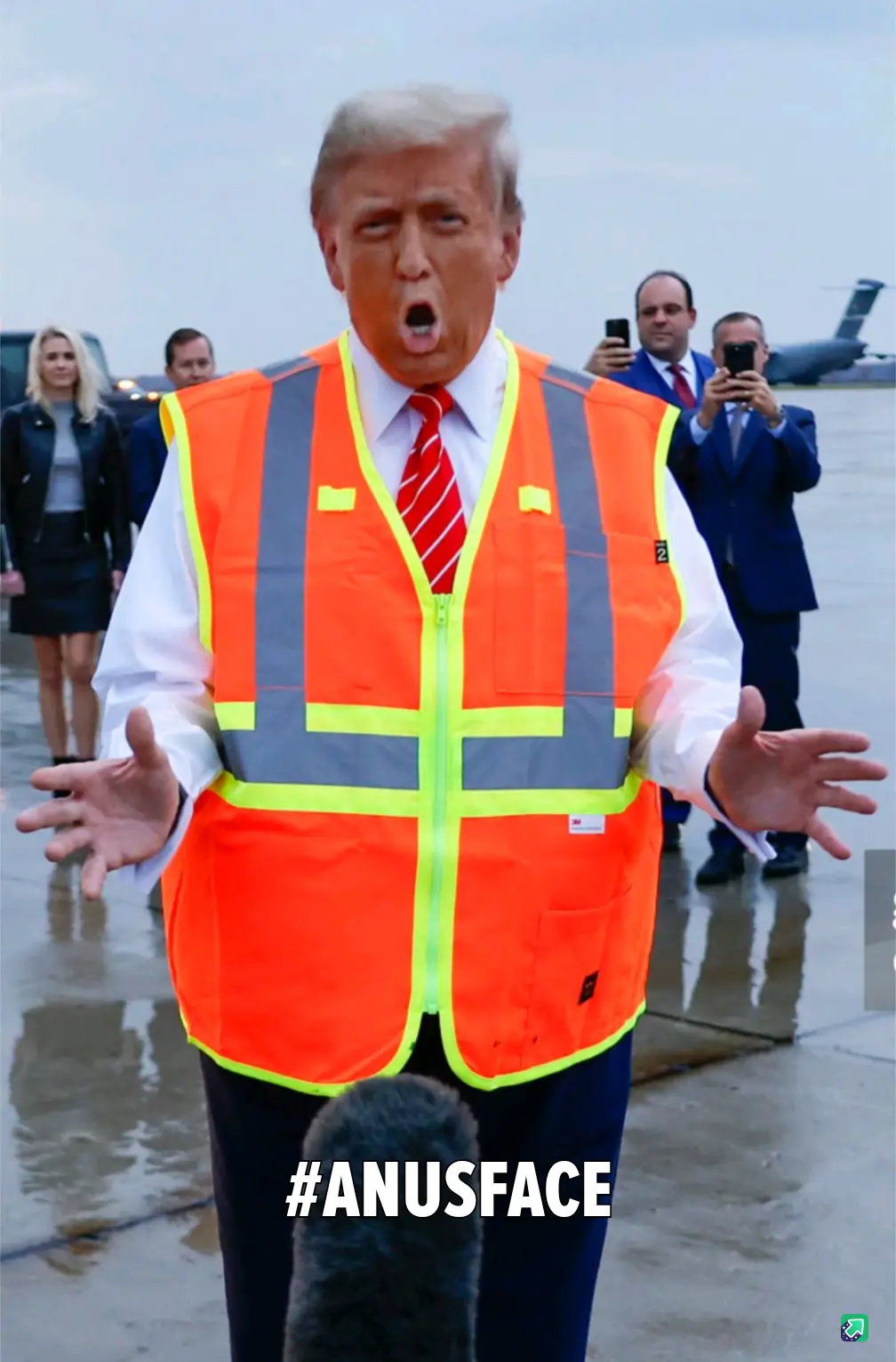 A man in a bright orange safety vest with reflective stripes, wearing a white shirt and red tie, stands with his mouth open…