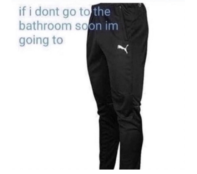 A pair of black Puma brand track pants with a white logo on the left thigh, displayed against a plain white background. The…