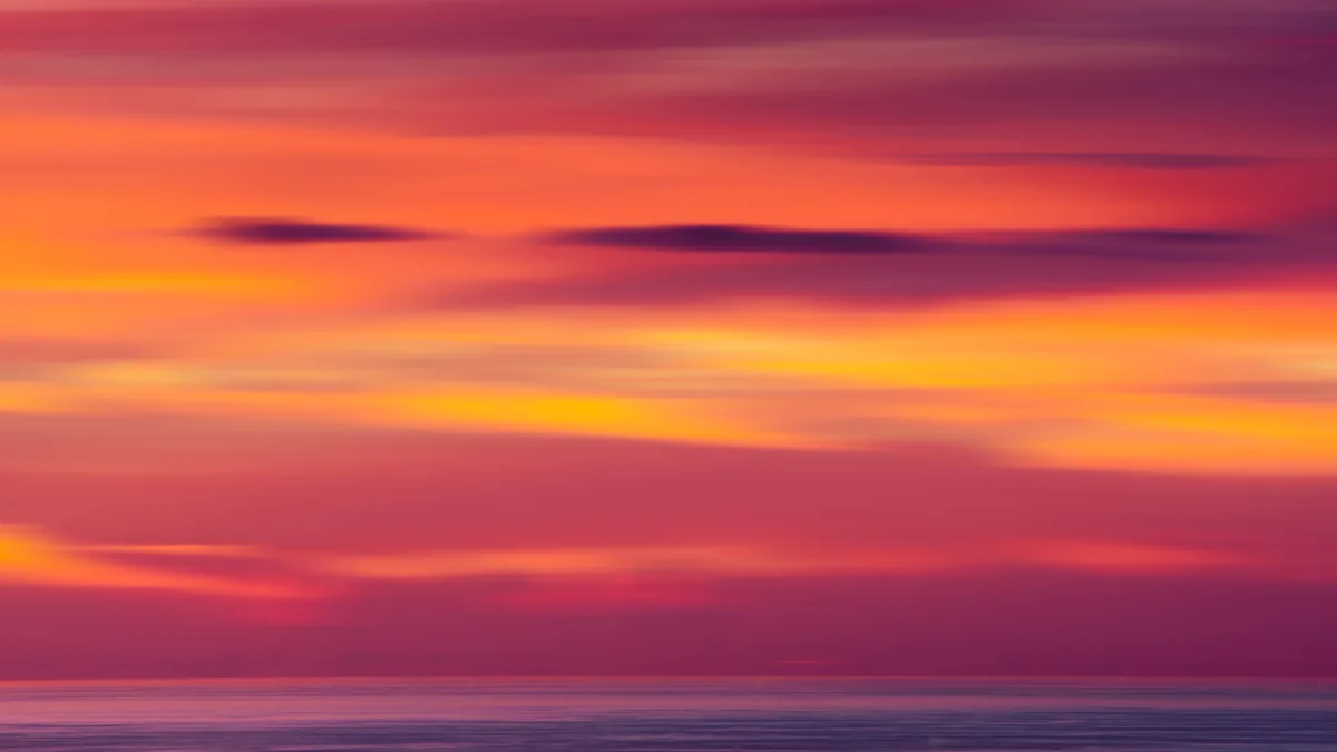 A breathtaking sunset, reminiscent of an abstract expressionist painting, where Mother Nature crafts colors by filtering…