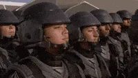 A sequence of six frames shows a soldier in a helmet and uniform, initially looking forward, then turning to face the camera…