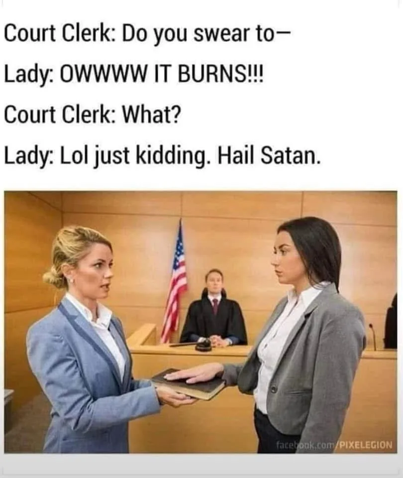 A woman in a courtroom setting is being asked to swear an oath by a court clerk holding a book. She reacts with exaggerated…