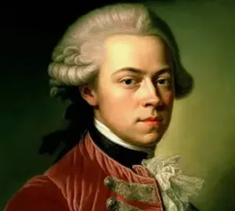 A classical portrait of a man with powdered wig and red coat, overlaid with the text 'the most beautiful man in the world'.