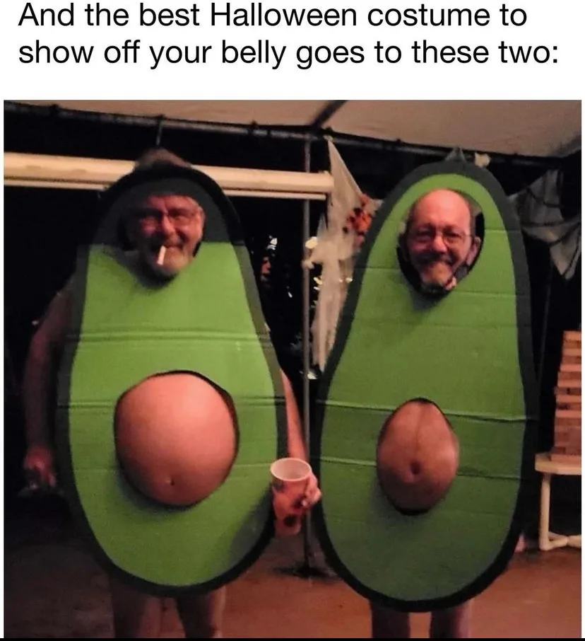 Two men wearing avocado costumes with large cutouts revealing their bare bellies, standing side by side. The text above…