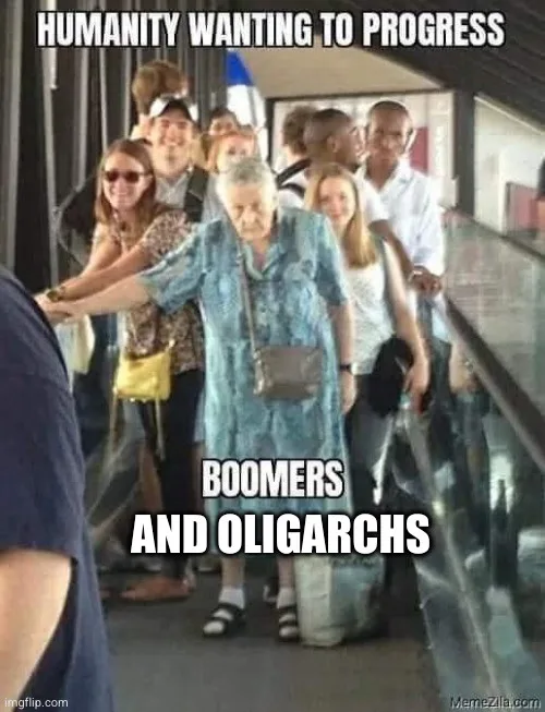 An elderly woman in a blue patterned dress stands on a moving walkway, holding onto the railing with both hands, while a…