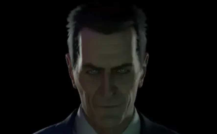 a close-up of a man with a serious, intense expression, wearing a suit and tie against a dark background. The overlaid text…