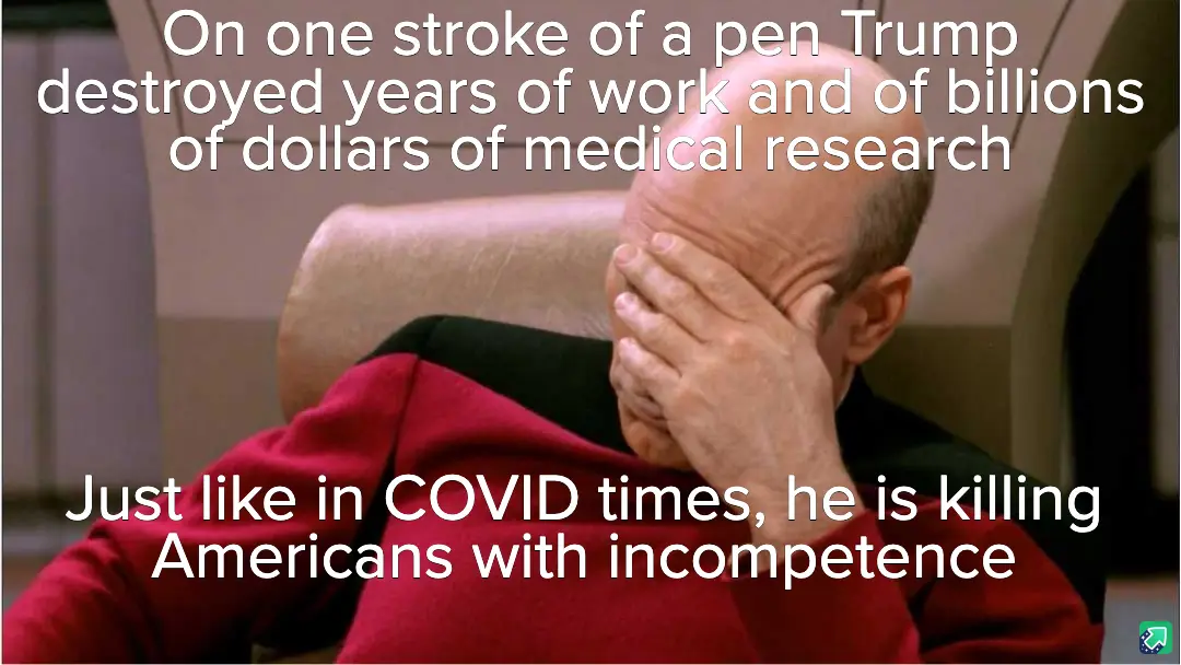 A man in a red Starfleet uniform sits in a chair, covering his face with his hand in a gesture of despair or frustration…