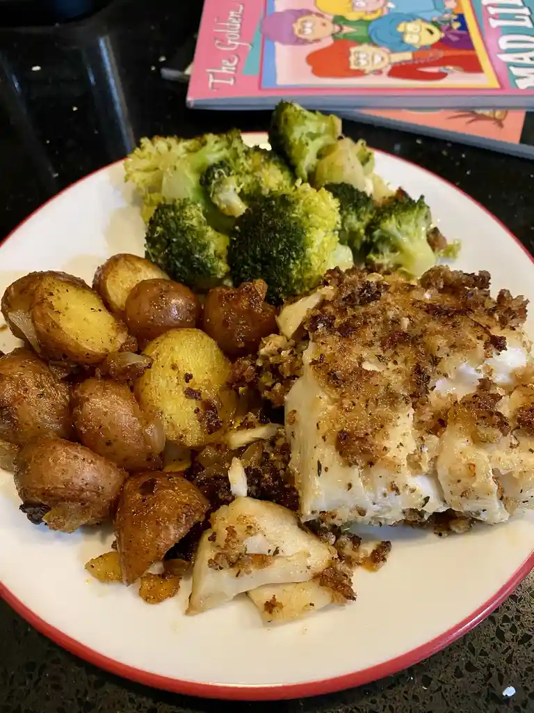 Indulge in Honey Chipotle Panko-crusted Cod with roasted potatoes and steamed broccoli, featuring a bonus Golden Girls photo bomb!