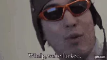A sequence of six frames shows a person wearing orange-tinted sunglasses and a dark winter hat, looking increasingly…