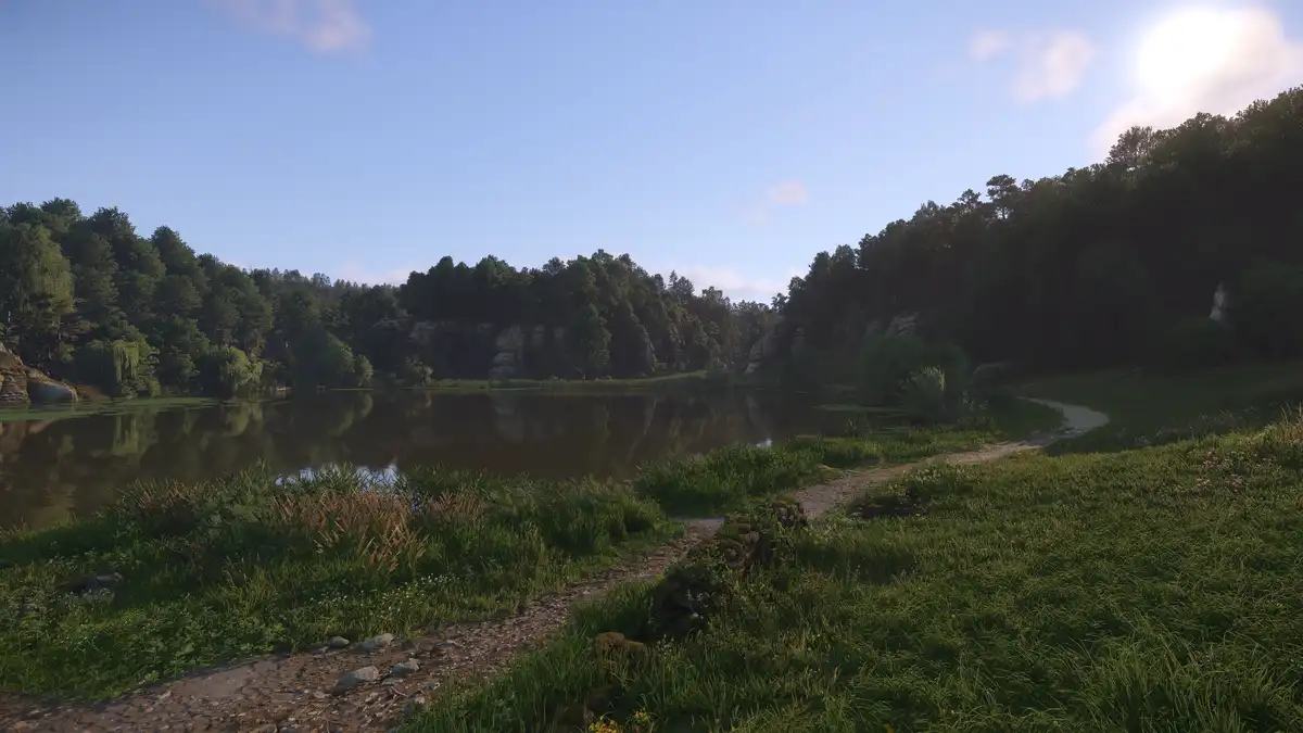 A serene, sunlit landscape featuring a calm lake surrounded by dense forests and rocky outcrops, with a dirt path winding…