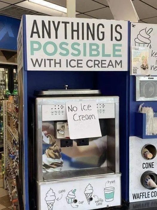 A blue ice cream vending machine with a large sign above reading 'ANYTHING IS POSSIBLE WITH ICE CREAM'. A handwritten note…