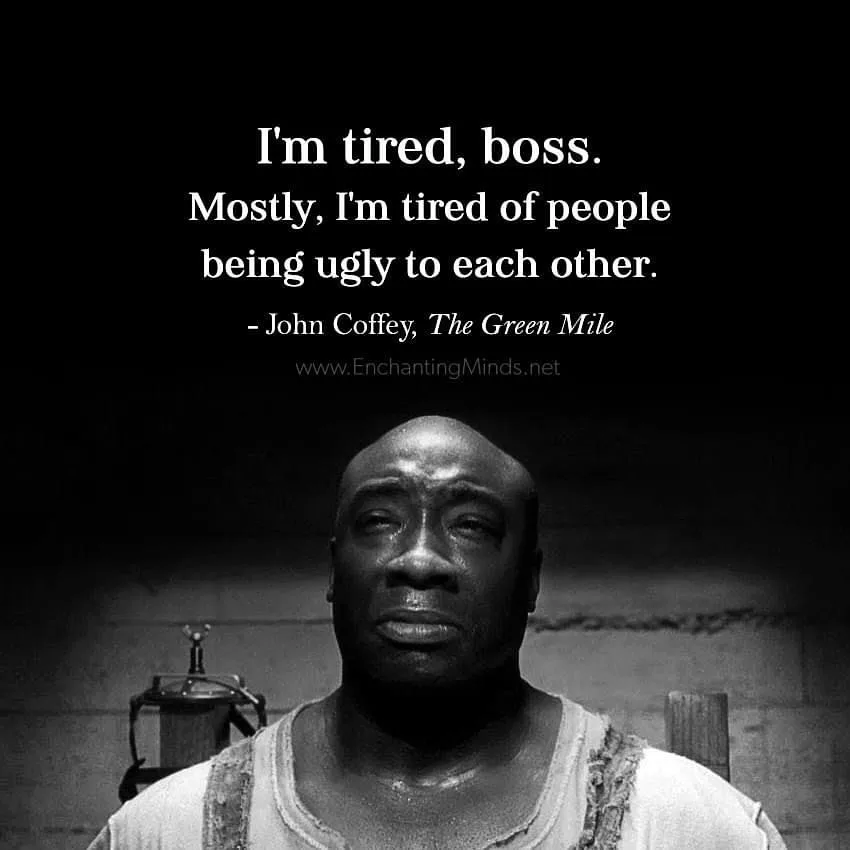 A black-and-white image of actor Michael Clarke Duncan as John Coffey from 'The Green Mile,' looking weary and sad. White…