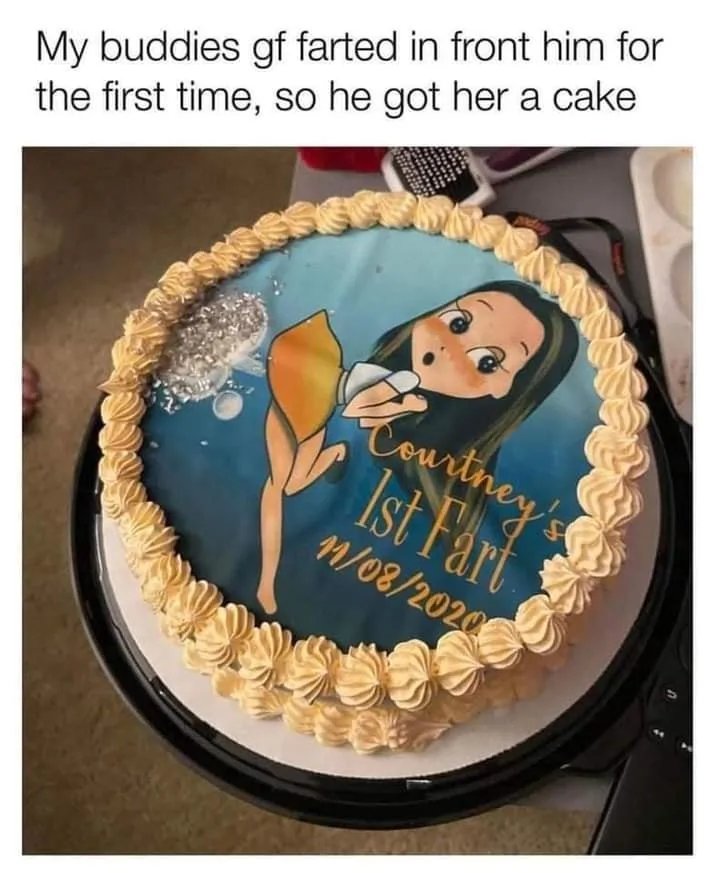 A round cake with piped yellow frosting borders features a cartoon illustration of a woman holding a seashell to her ear…