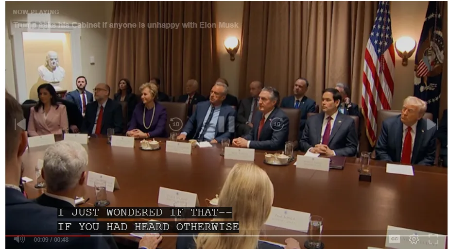 A still from a video shows Donald Trump seated at a long wooden table with his cabinet members in a formal meeting room…