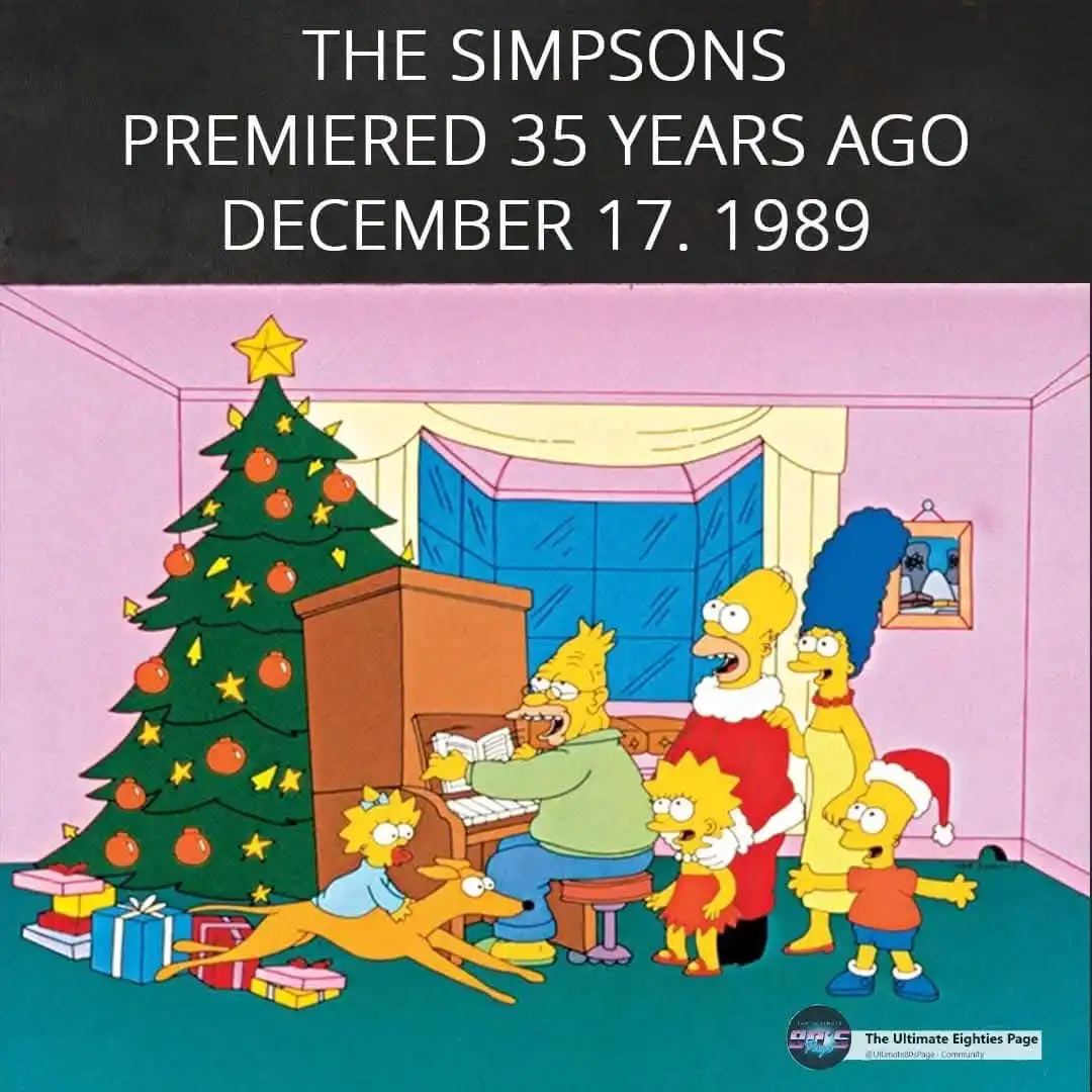 A still from The Simpsons shows the family gathered in a living room decorated for Christmas, with a tree, presents, and…
