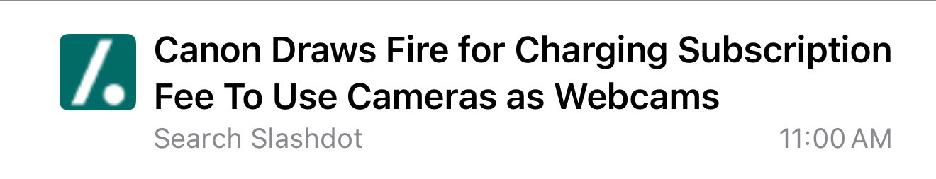 A screenshot of a Slashdot news headline with a green logo featuring a white slash. The headline reads 'Canon Draws Fire for…