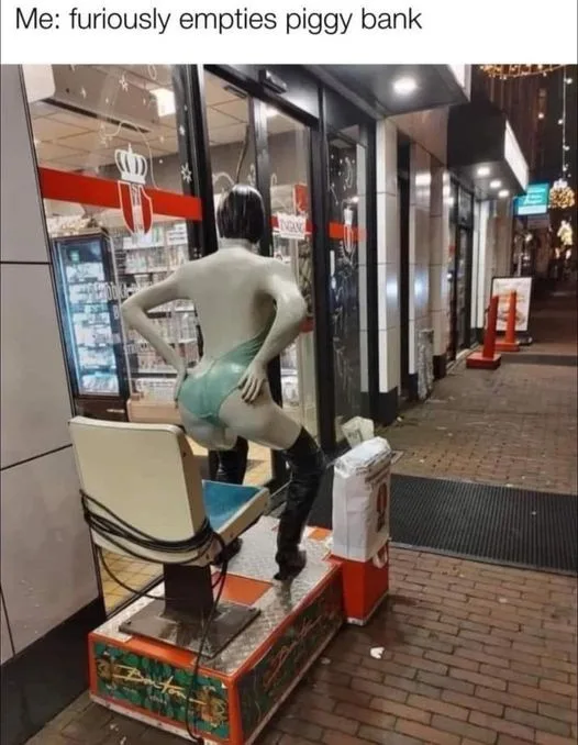 A statue of a person in a revealing outfit, viewed from behind, is seated on a barber chair outside a store. The statue…
