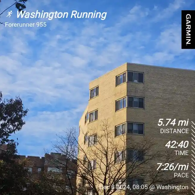 A screenshot of a Garmin Forerunner 955 running watch displaying a workout summary overlaid on a photo of a brick building…
