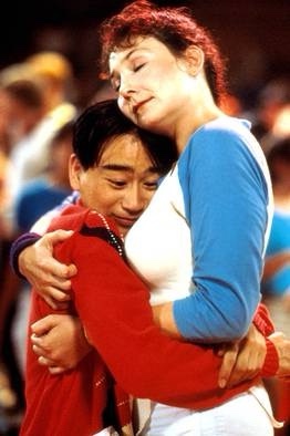 A still from the 1993 film 'The Parent Trap' shows a young girl in a red sweater hugging a young boy in a blue shirt, both…