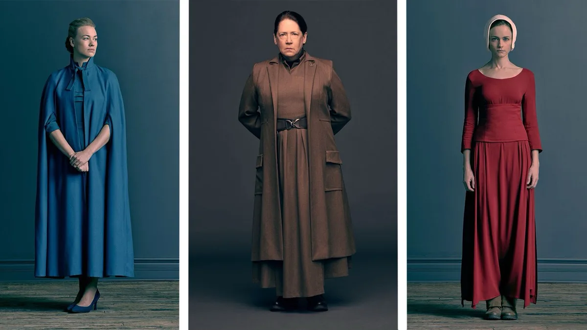 Three women stand in separate panels against muted backgrounds, each wearing distinct, somber, and symbolic clothing from…