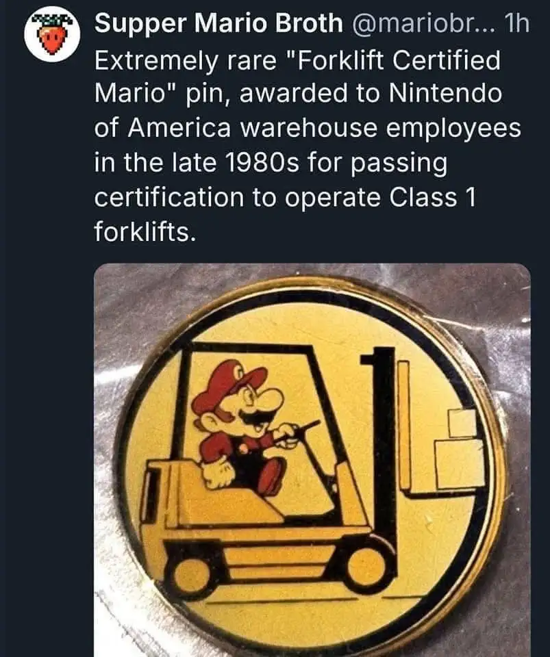 A circular, yellow pin depicts the video game character Mario driving a forklift, with boxes on the lift. The pin is shown…