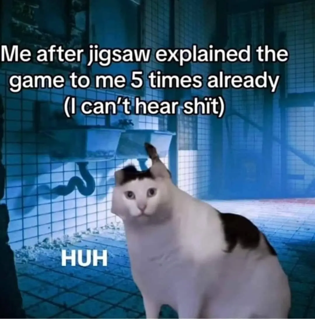 A white cat with black patches sits in a blue-tinted, tiled room with a snake-like shadow on the wall. The cat has a…
