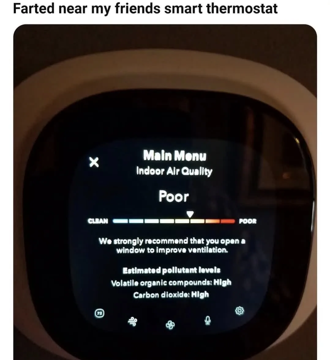 A close-up of a smart thermostat screen displaying 'Main Menu Indoor Air Quality' with a 'Poor' rating. The screen shows a…
