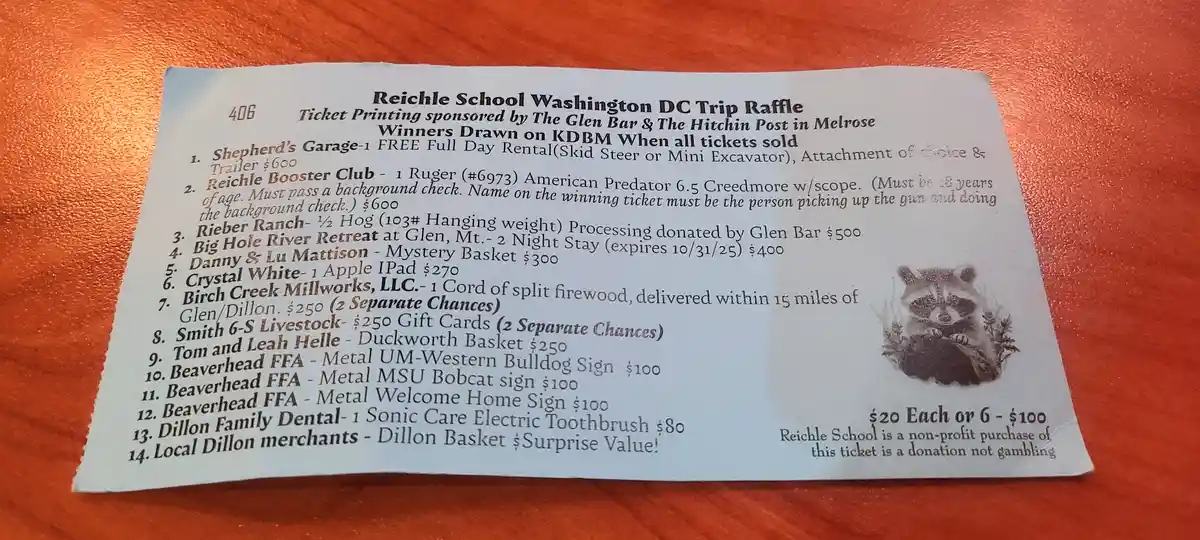 A printed raffle ticket for Reichle School's Washington DC trip lists prizes including a Ruger rifle, a half hog, an iPad…