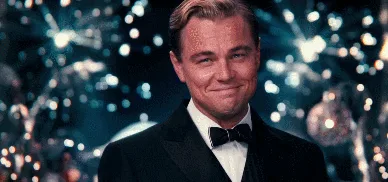 A six-panel GIF shows Leonardo DiCaprio in a tuxedo at a glamorous party with sparkling lights, smiling smugly and slowly…