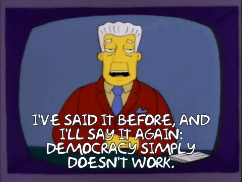 The image shows six panels of a cartoon man with white hair, wearing a red suit and blue tie, appearing on a television…