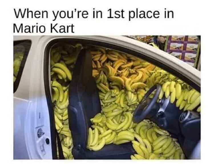 The image shows the interior of a white car with its door open, completely filled with yellow bananas, obscuring the seats…