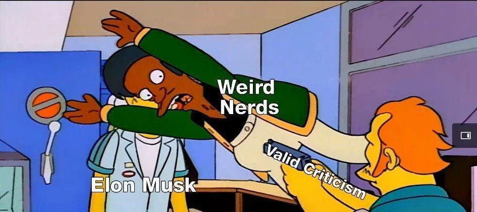 A cartoon image from The Simpsons shows a character labeled 'Elon Musk' being physically restrained by another character…