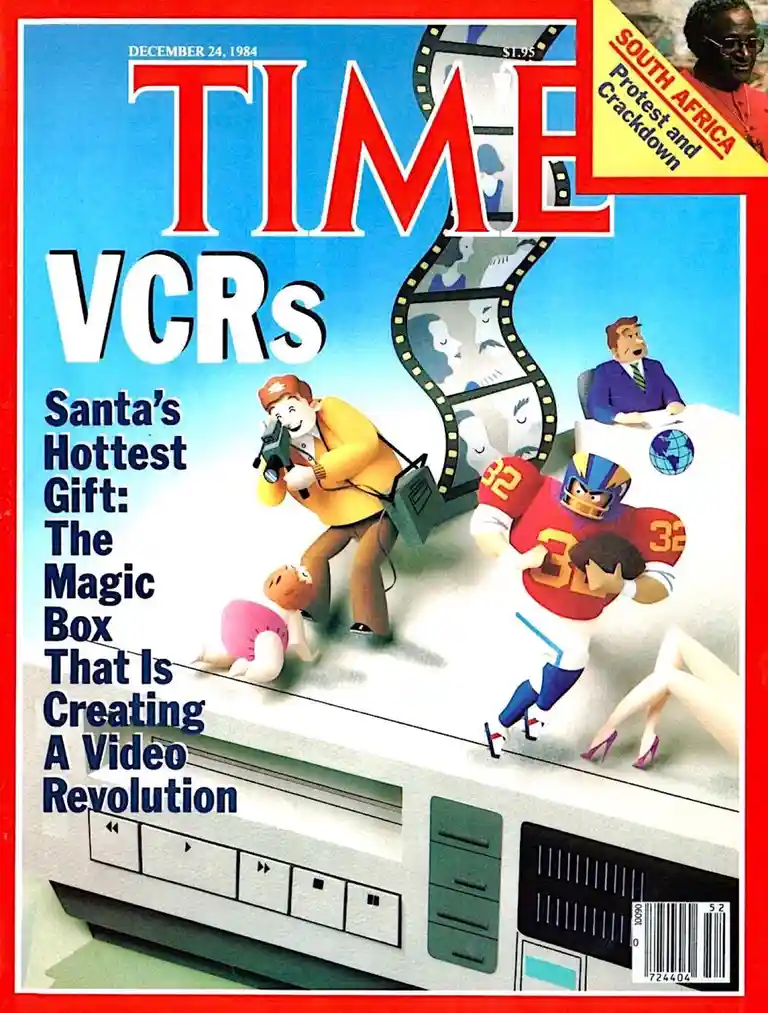 The image is a vintage TIME magazine cover from December 24, 1984, featuring a large VCR as the central object. Cartoon…