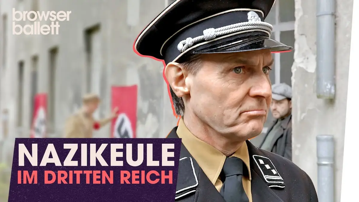A man in a Nazi uniform with a stern expression is shown in a scene from a historical film, with the overlaid text…