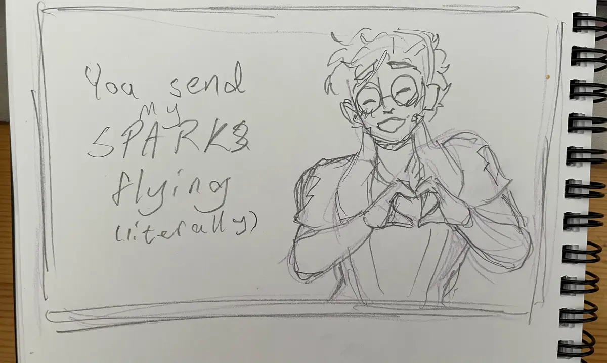 A hand-drawn pencil sketch on a spiral-bound notebook page shows a cartoon character with curly hair and glasses, smiling…