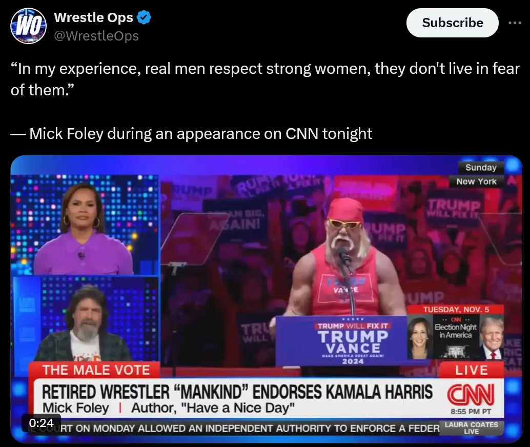 A screenshot from a CNN broadcast shows retired wrestler Mick Foley, wearing a red tank top and sunglasses, speaking at a…