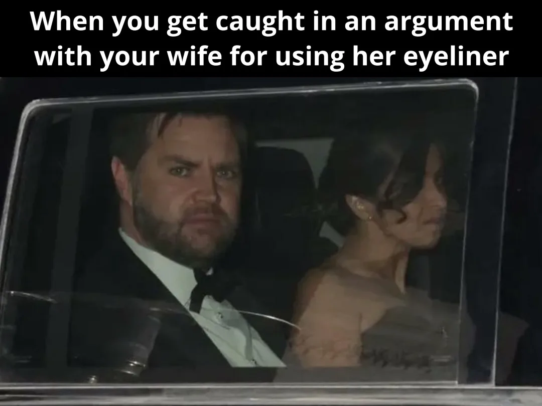 A man and woman are seen sitting in a car at night, viewed through the window. The man, wearing a tuxedo, has a very angry…