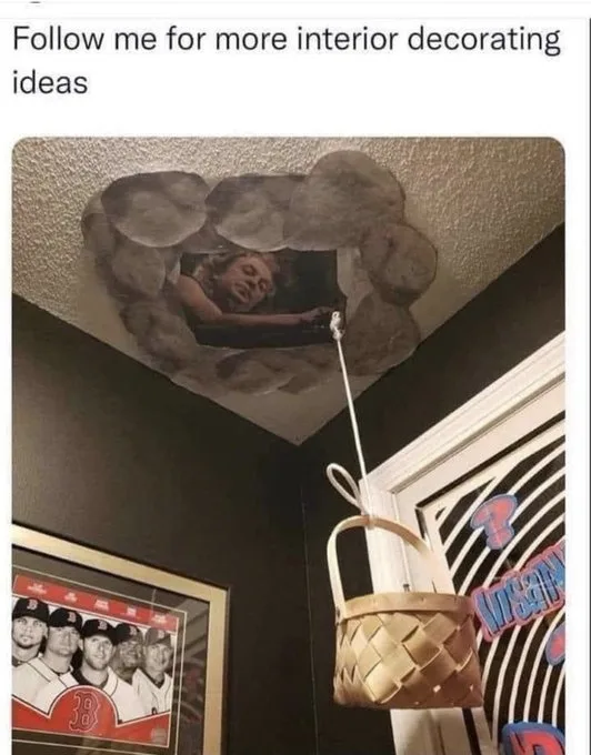 A room with dark walls and a textured ceiling features a large, cut-out hole shaped like a cloud, revealing a photo of…