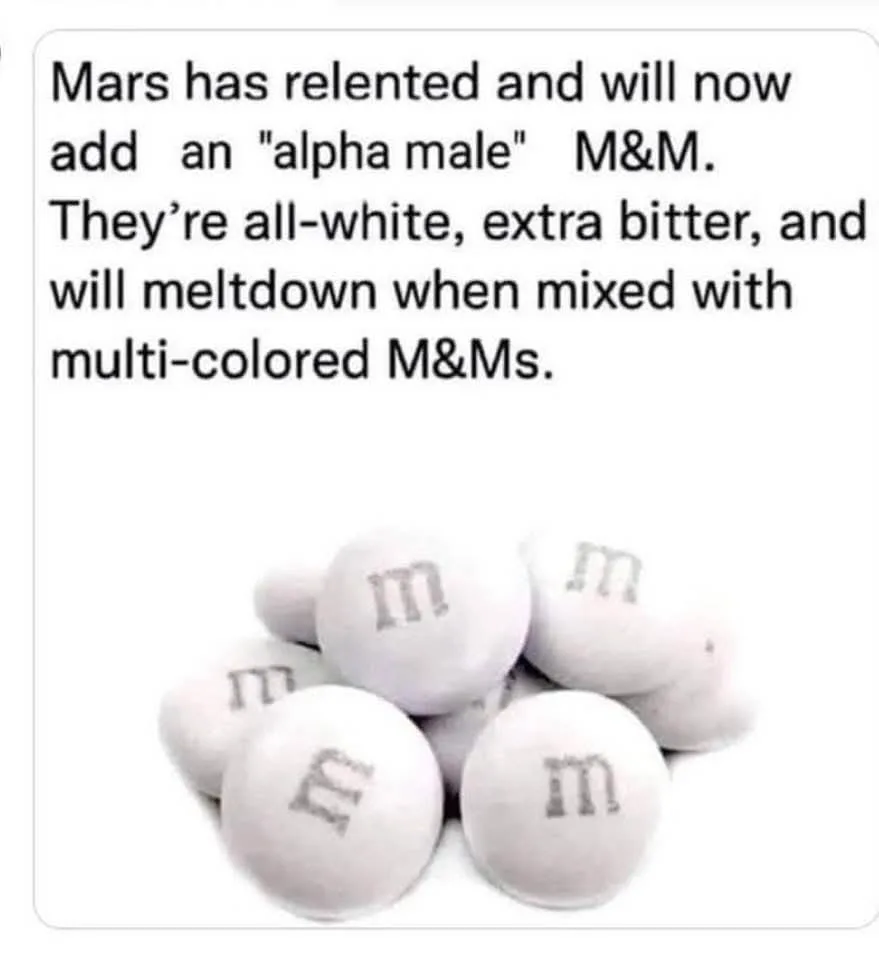 A pile of plain white M&M candies with the letter 'm' printed on them, overlaid with text claiming Mars is introducing an…