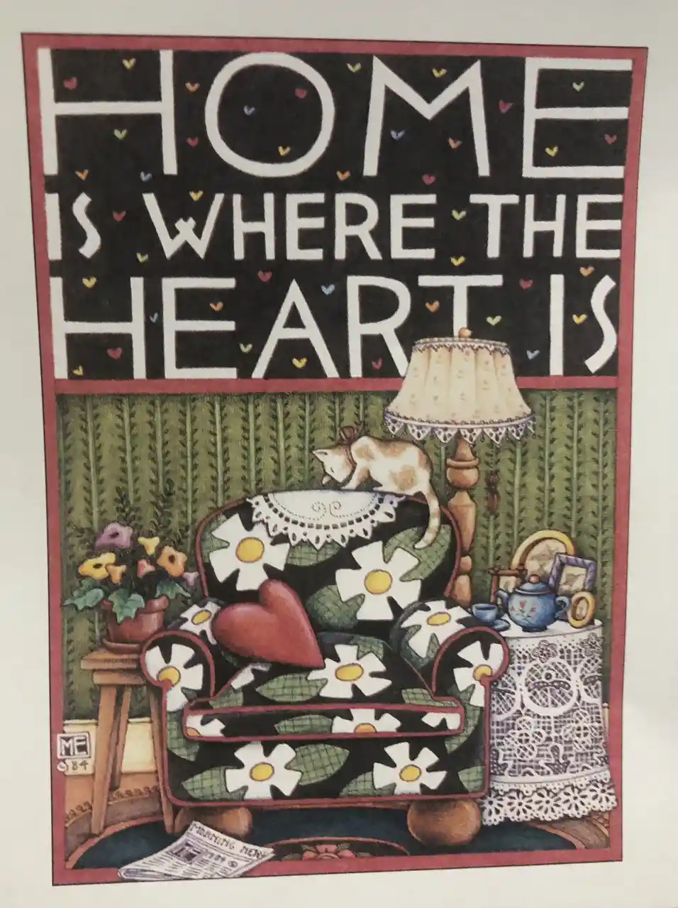 A cozy, vintage-style illustration depicts a floral-patterned armchair with a large red heart cushion, a cat perched on the…