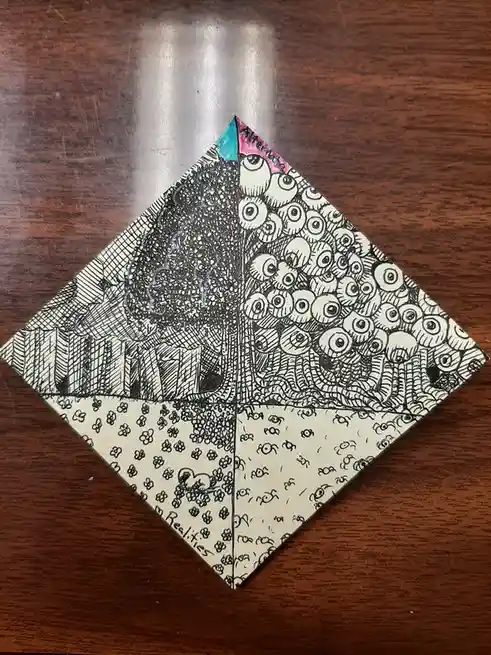 A hand-drawn diamond-shaped artwork divided into four quadrants, each depicting a different surreal scene: one with a stormy…