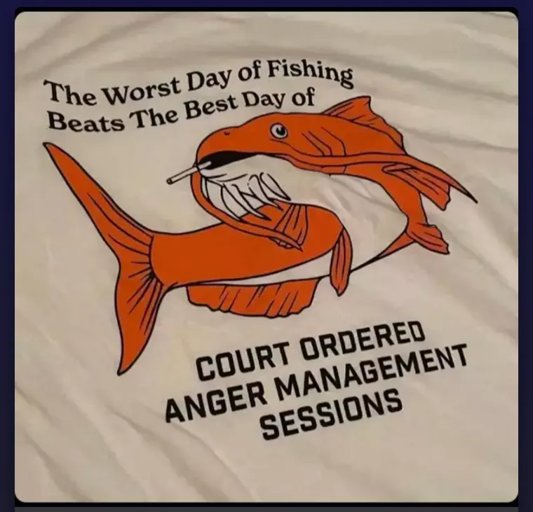 A white t-shirt features a cartoon illustration of an orange fish biting into another orange fish, which has a cigarette in…