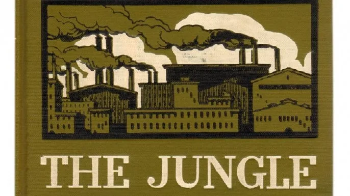 The image shows the cover of the book 'The Jungle' by Upton Sinclair, featuring a stylized illustration of industrial…