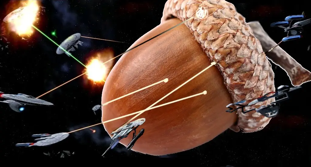 A giant acorn is depicted in space, surrounded by Star Trek-style starships firing lasers at it. The acorn's cap and nut are…
