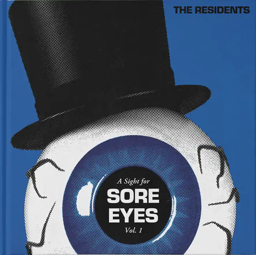 The image shows an album cover featuring a large, stylized human eye with a black top hat perched on its upper lid, set…