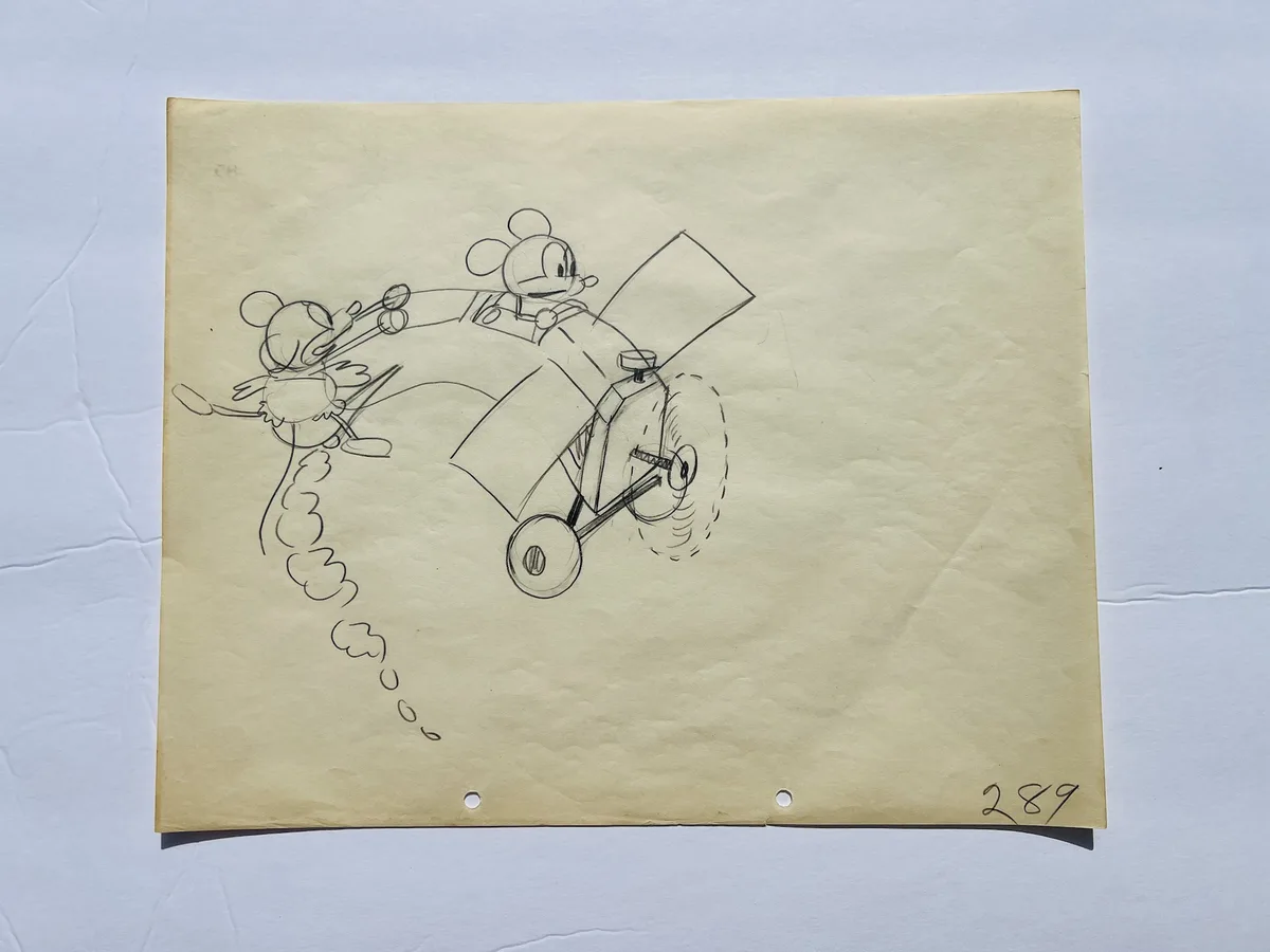 A vintage pencil sketch on aged paper shows two early Mickey Mouse characters: one piloting a rudimentary biplane with a…