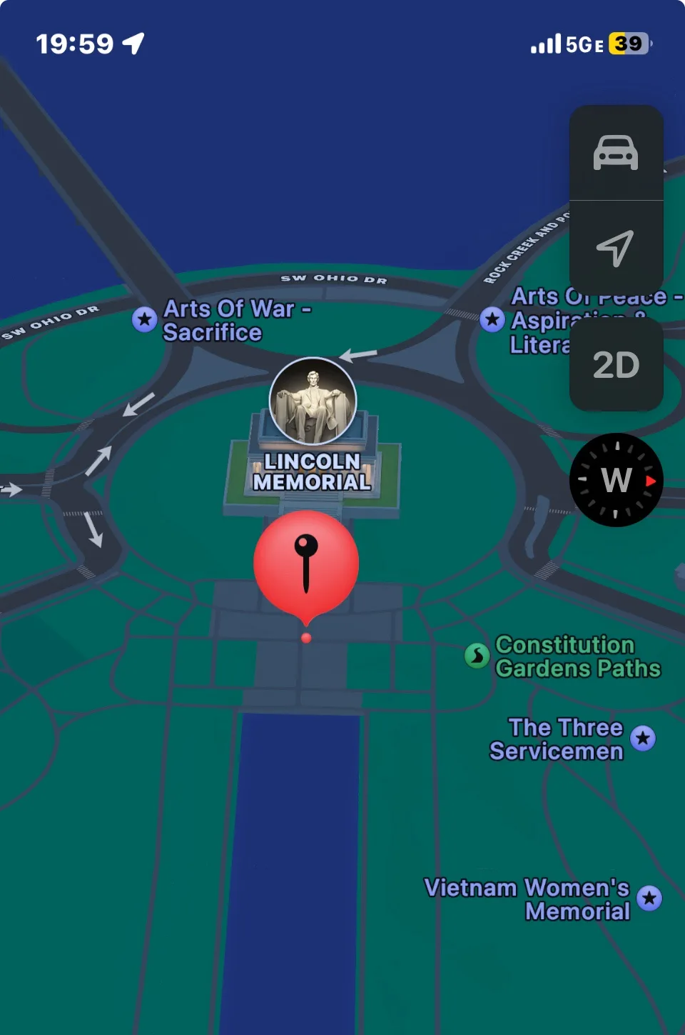A smartphone navigation map screenshot shows a red location pin placed directly on the Lincoln Memorial, with nearby…