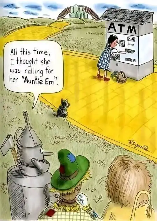 A cartoon depicts Dorothy from The Wizard of Oz standing on the yellow brick road at an ATM machine, withdrawing money. In…
