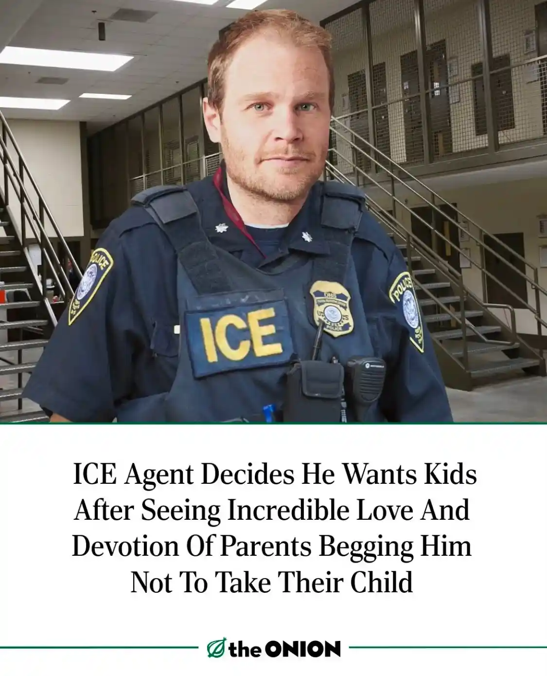 A man in an ICE uniform stands in what appears to be a jail or detention center hallway with stairs and barred cells in the…