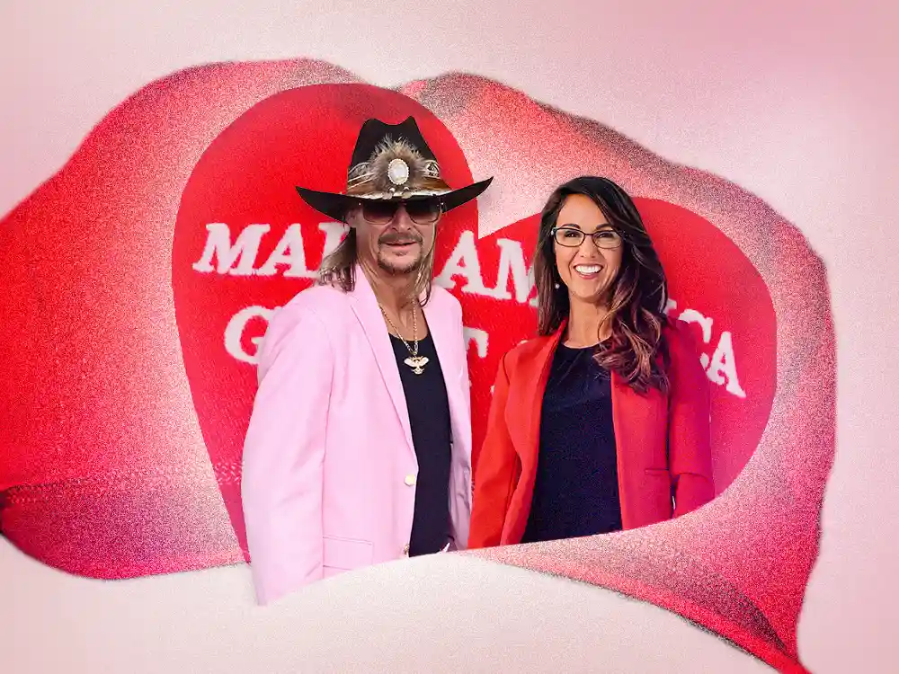 Two people, a man in a pink blazer and cowboy hat and a woman in a red blazer, are framed within a large red lip shape…