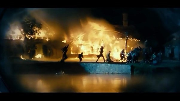 A nighttime scene from 'The Hobbit: An Unexpected Journey' shows silhouetted dwarves running away from a large, roaring fire…